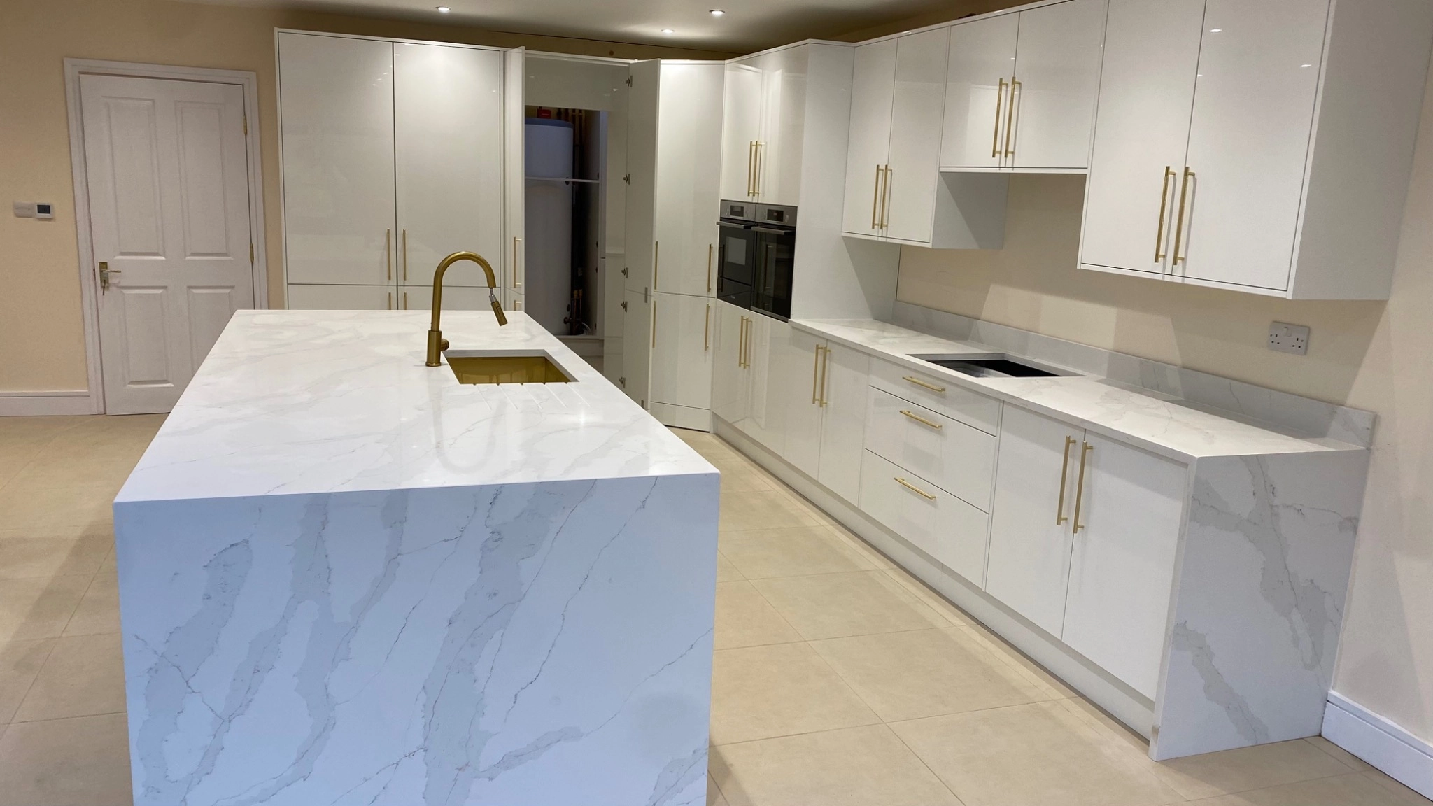 Calacatta Gold quartz worktop with grey and gold veining